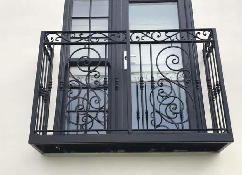 Ornate wrought iron balcony with decorative scrollwork