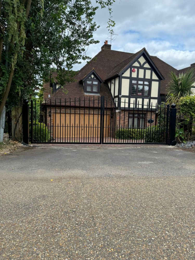 Black wrought iron driveway gate
