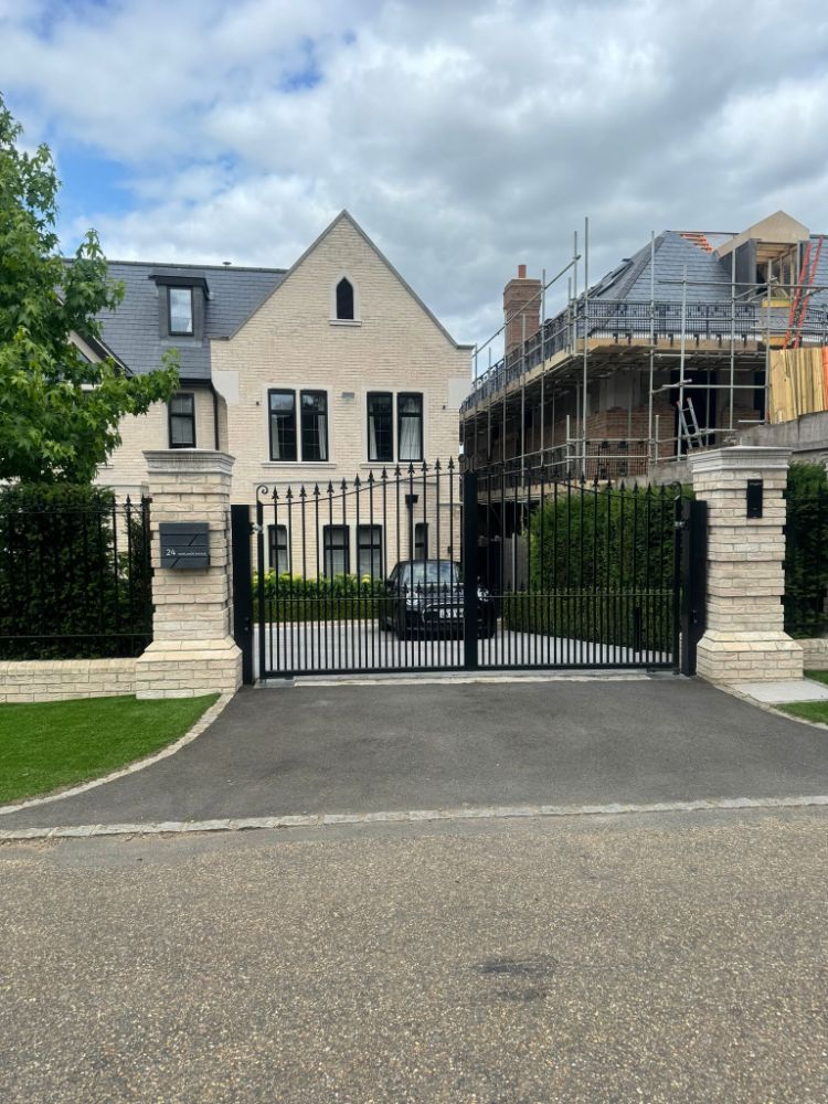 Elegant residential gate with stone pillars