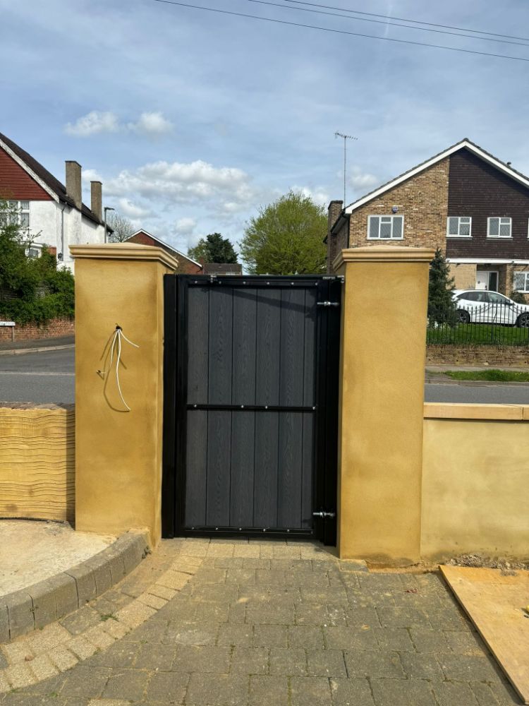 Simple black vertical slat pedestrian gate