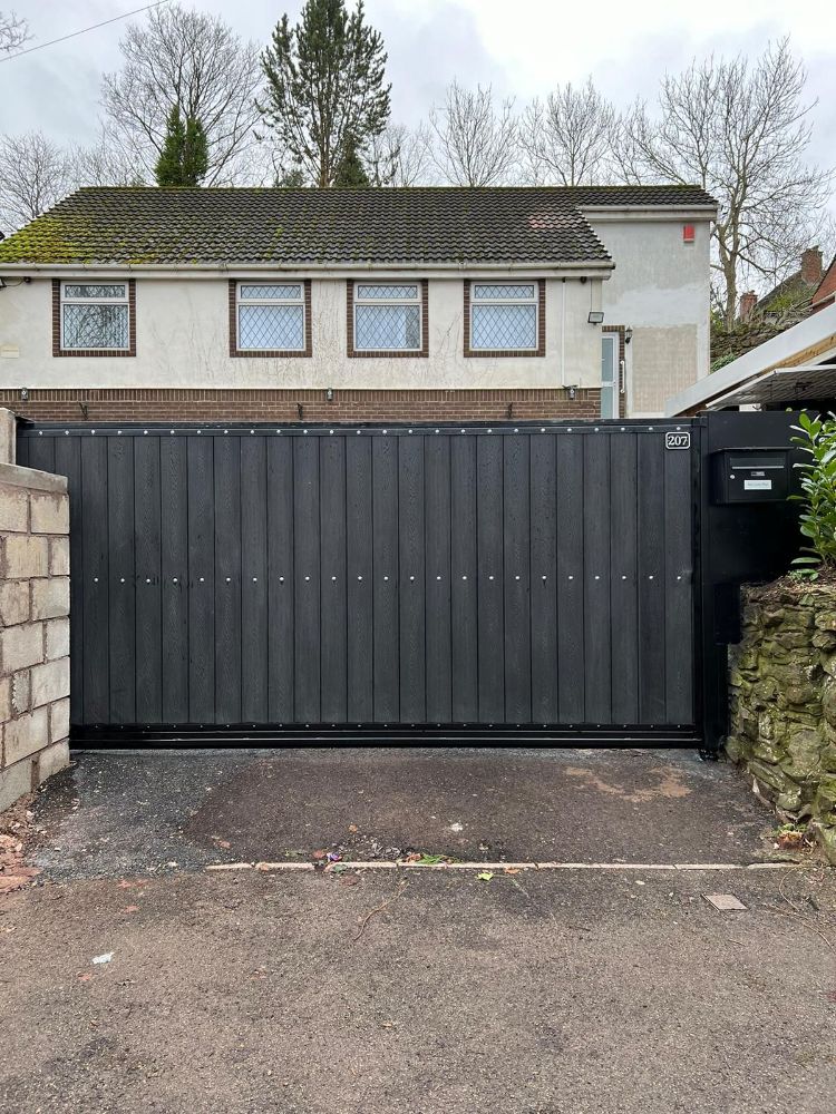 Large sliding gate with vertical black slats