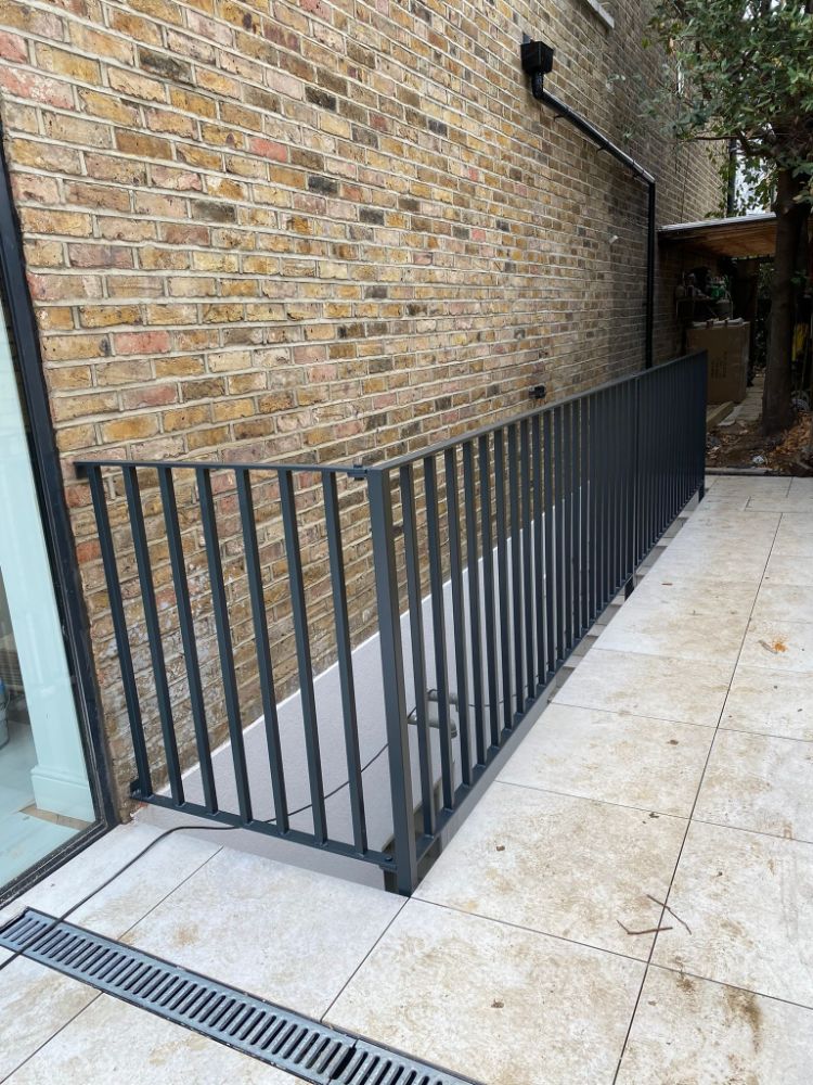 Black metal railing on patio