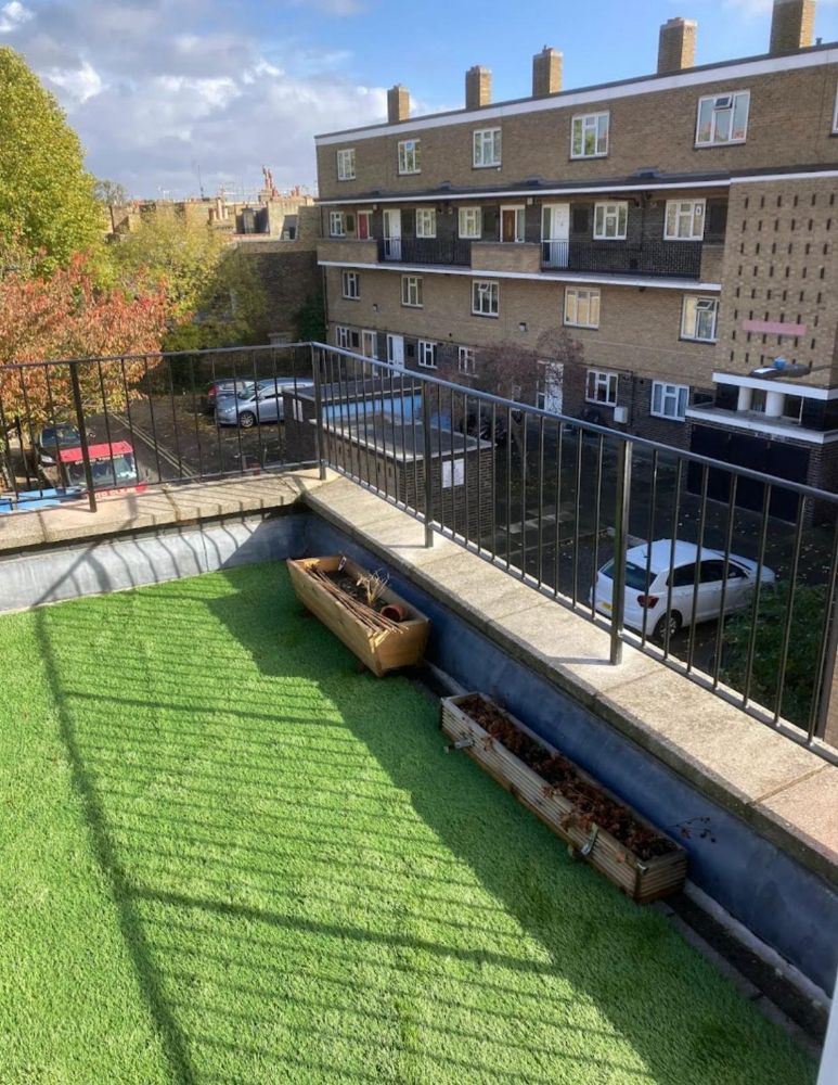 Simple black vertical bar railings on rooftop terrace