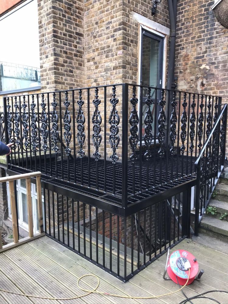 Traditional black wrought iron balcony with decorative elements